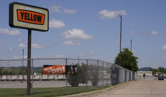 A sign for Yellow Corp. trucking company stands outside its facility on July 31 in Nashville, Tennessee. Yellow Corp. just declared Chapter 11 bankruptcy on Sunday, which comes only three years after Yellow received $700 million in pandemic-era loans from the federal government.