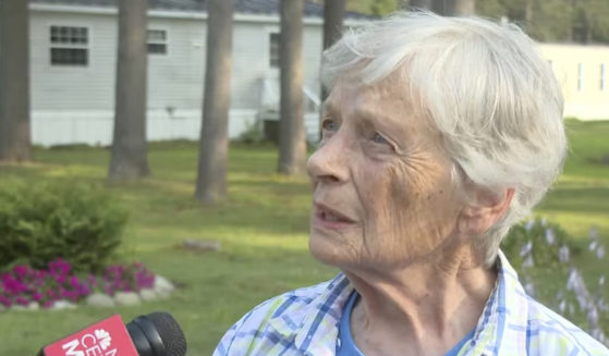 Marjorie Perkins speaks to a reporter on Wednesday at her home in Brunswick, Maine.