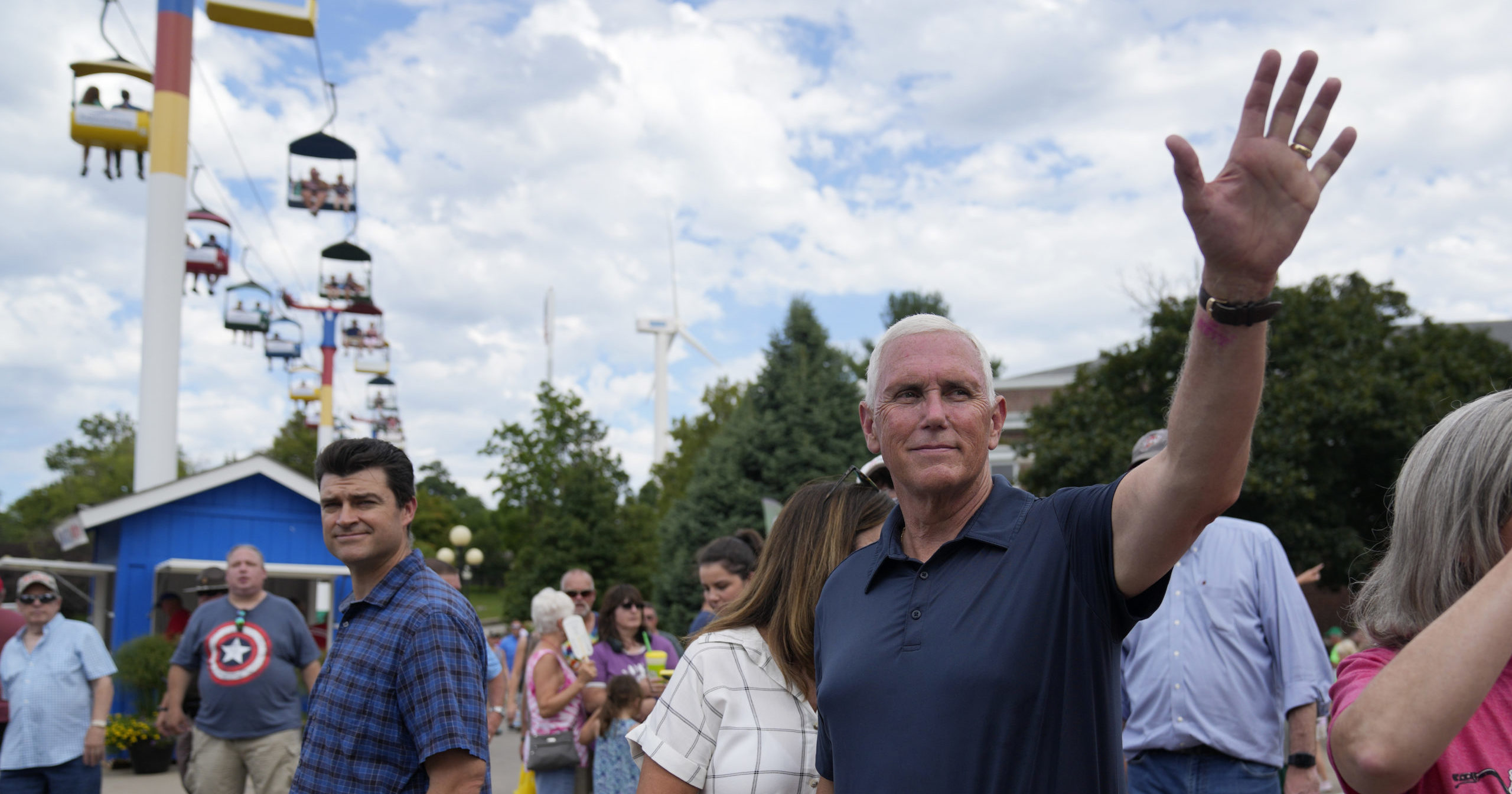 Republican presidential candidate former Vice President Mike Pence waves as he tours the grounds at the Iowa State Fair, Friday, Aug. 11, 2023, in Des Moines, Iowa.