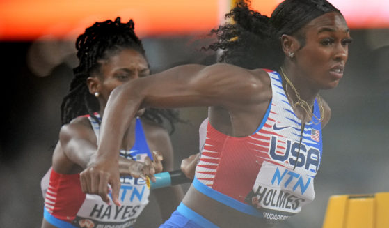 U.S. runners Alexis Holmes and Quanera Hayes fail to make the final baton exchange in a women's 4x400-meter relay heat Saturday during the World Championships in track and field in Budapest, Hungary. The U.S. 4x400 team was disqualified during the event.