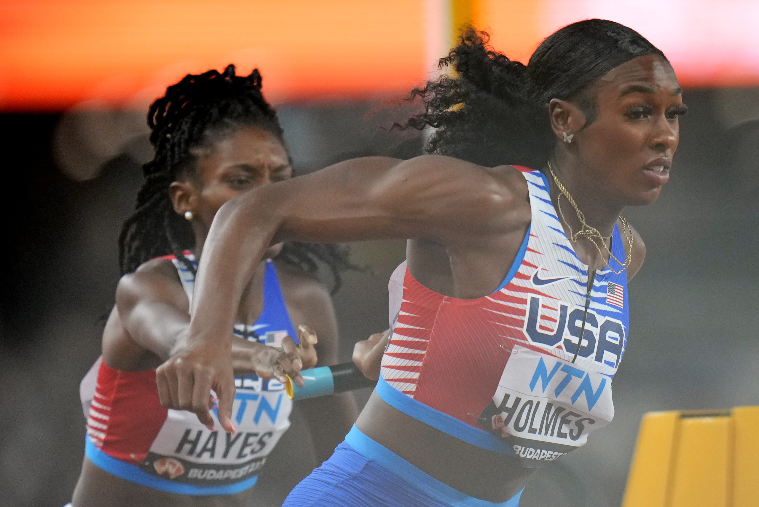 U.S. runners Alexis Holmes and Quanera Hayes fail to make the final baton exchange in a women's 4x400-meter relay heat Saturday during the World Championships in track and field in Budapest, Hungary. The U.S. 4x400 team was disqualified during the event.