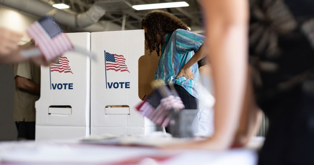 A woman casts her vote in this stock image.