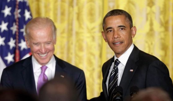 Former President Barack Obama, right, with former Vice President Joe Biden, speaks in the East Room of the White House in Washington, D.C., on June 13, 2013.