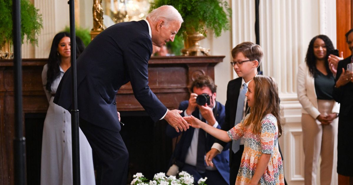 President Joe Biden greets children after speaking in the East Room of the White House in Washington, D.C., on Wednesday.