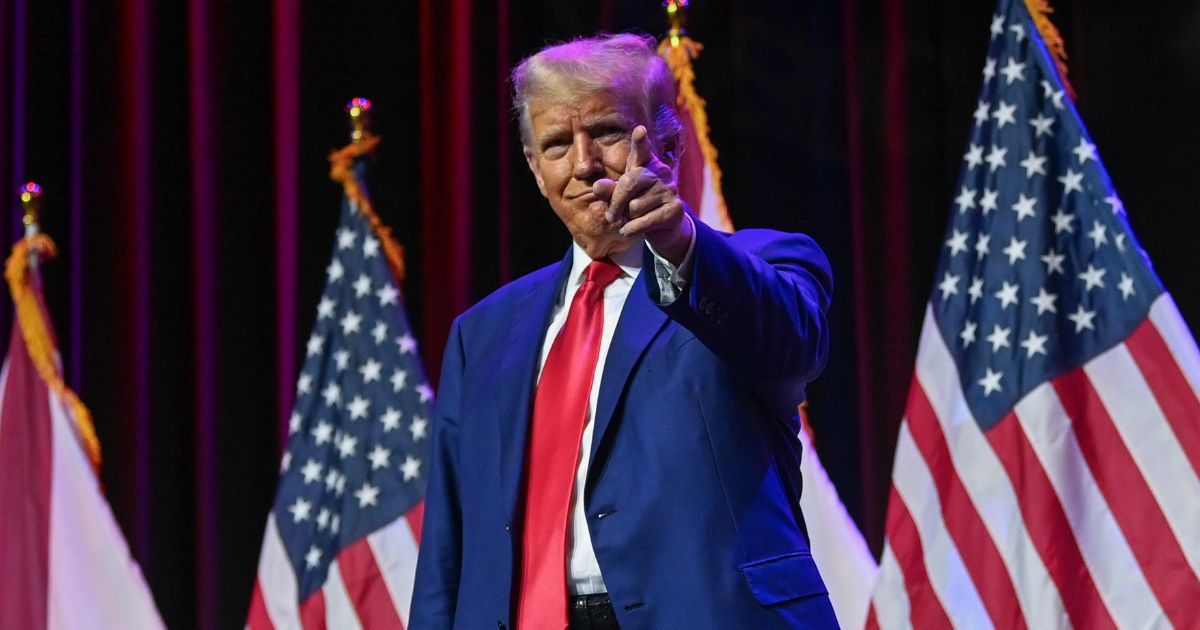 Former President Donald Trump gestures onstage during the Alabama Republican Party’s 2023 summer meeting on Friday in Montgomery.