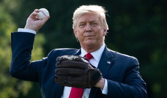 Then-President Donald Trump throws a baseball on the South Lawn of the White House on July 23, 2020, in Washington, D.C.