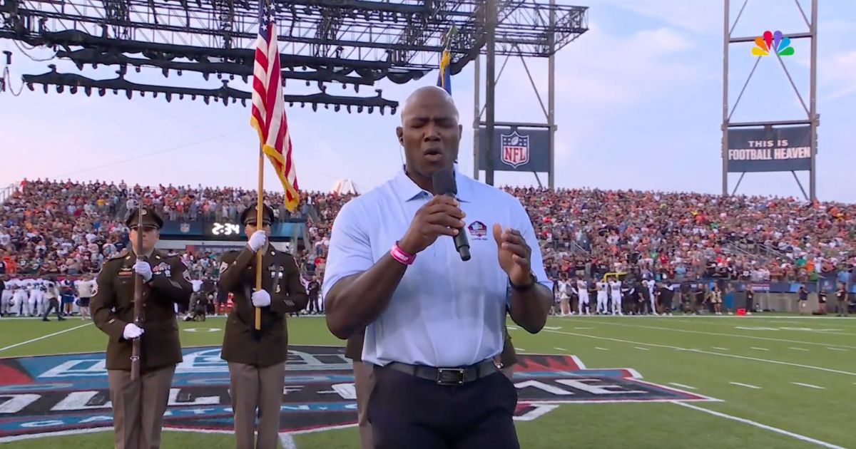 NFL Hall of Fame Demarcus Ware sings the Star Spangled Banner at the Hall of Fame game at Tom Benson Hall of Fame Stadium in Canton, Ohio, on Thursday.