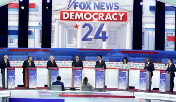 The other candidates on stage listen as Florida Gov. Ron DeSantis, center, speaks during the Republican presidential primary debate hosted by Fox News in Milwaukee on Wednesday.