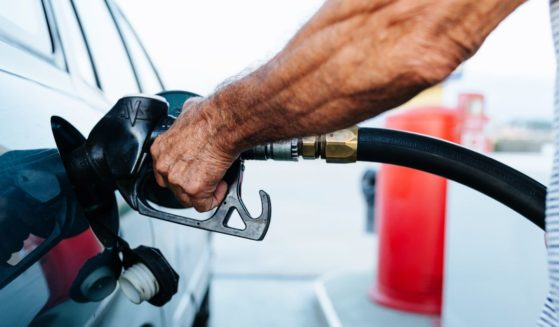 This stock photo depicts a man refueling his car at a gas station. Florida officials are now warning that some gas may be contaminated with diesel.