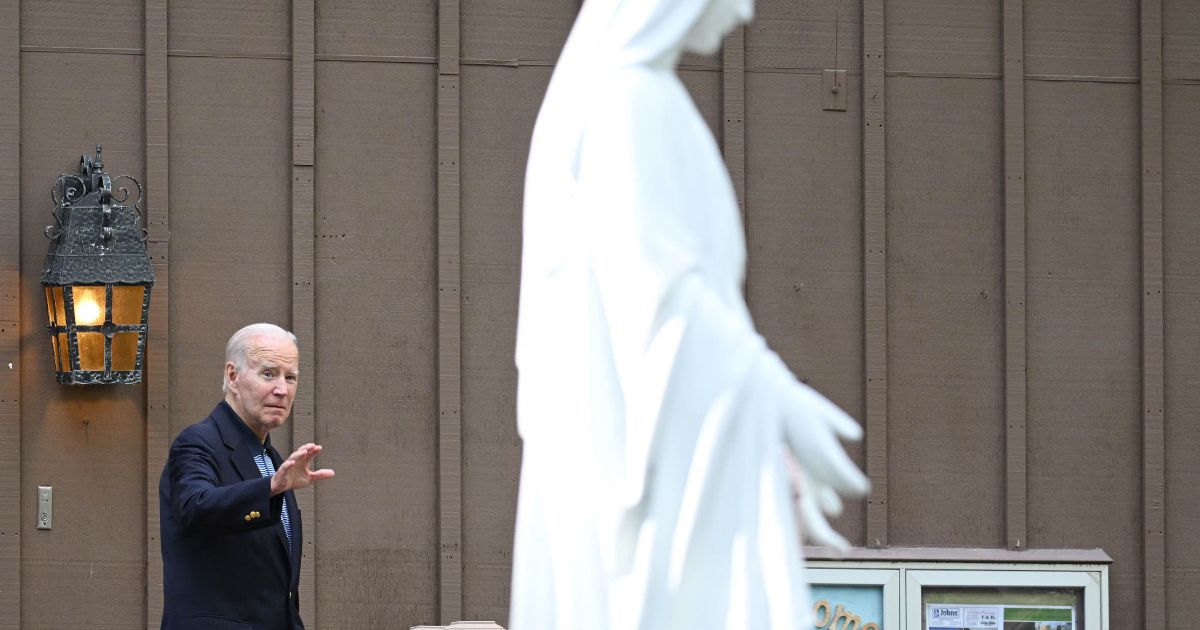 President Joe Biden waves as he leaves Our Lady of Tahoe Catholic Church in Zephyr Cove, Nevada, on Saturday.