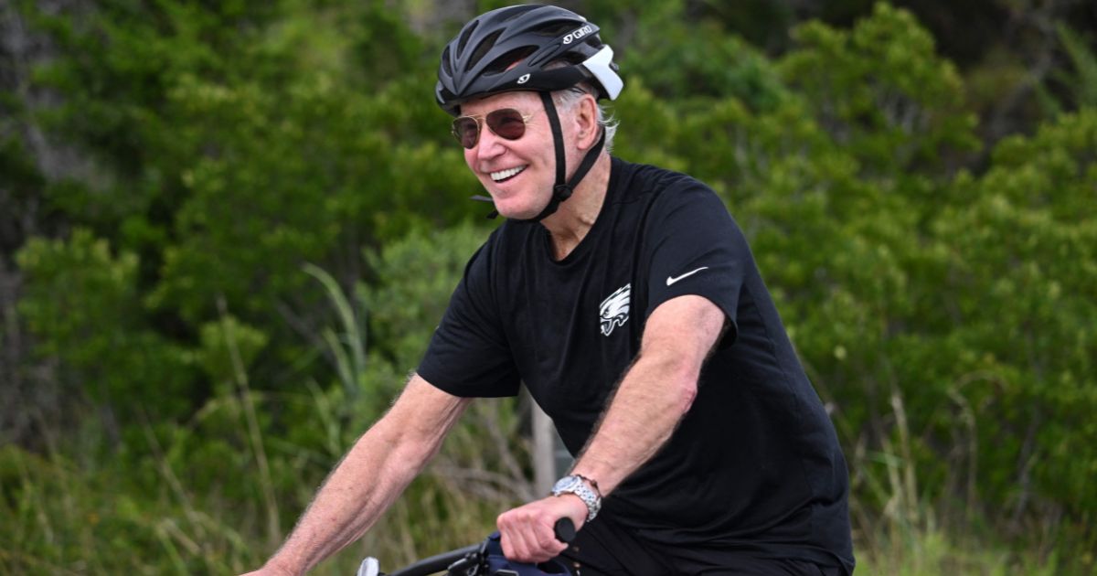 President Joe Biden rides his bike in Gordon's Pond State Park in Rehoboth Beach, Delaware, on Monday.