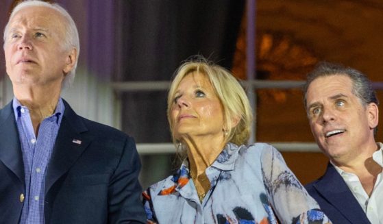 President Joe Biden, left, first lady Jill Biden, middle, and Hunter Biden, right, watch the Fourth of July Fireworks from the White House on July 4.