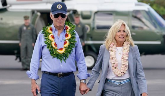 President Joe Biden and first lady Jill Biden walk to board Air Force One after visiting the site of the devastating Maui wildfires in Kahului, Hawaii, on Monday.
