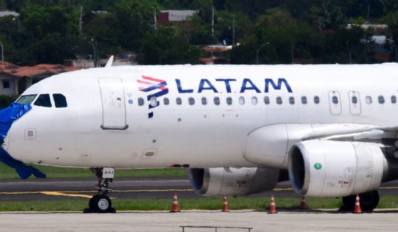 A Latam Airlines plane is pictured after an emergency landing on the eve at Silvio Pettirossi International Airport in Luque, Paraguay, on October 27, 2022. (Noberto Duarte / AFP-Getty Images)