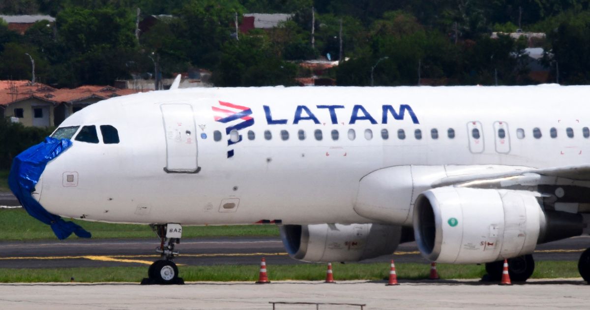 A Latam Airlines plane is pictured after an emergency landing on the eve at Silvio Pettirossi International Airport in Luque, Paraguay, on October 27, 2022. (Noberto Duarte / AFP-Getty Images)