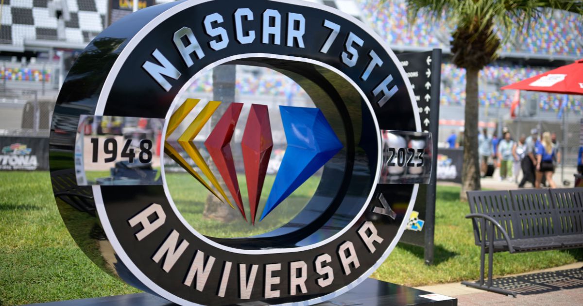 A sign celebrating the 75th anniversary of NASCAR is displayed at Daytona International Speedway in Daytona Beach, Florida, on Saturday.