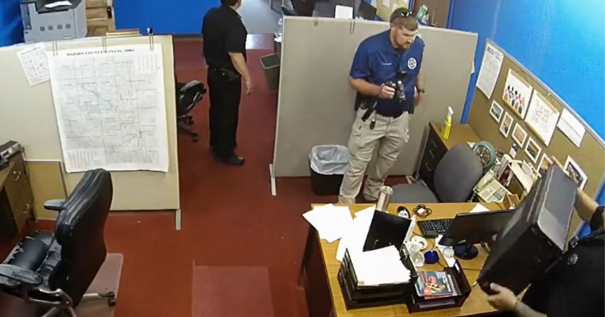 Police in Marion, Kansas, raid the office of the Marion County Record on Friday.