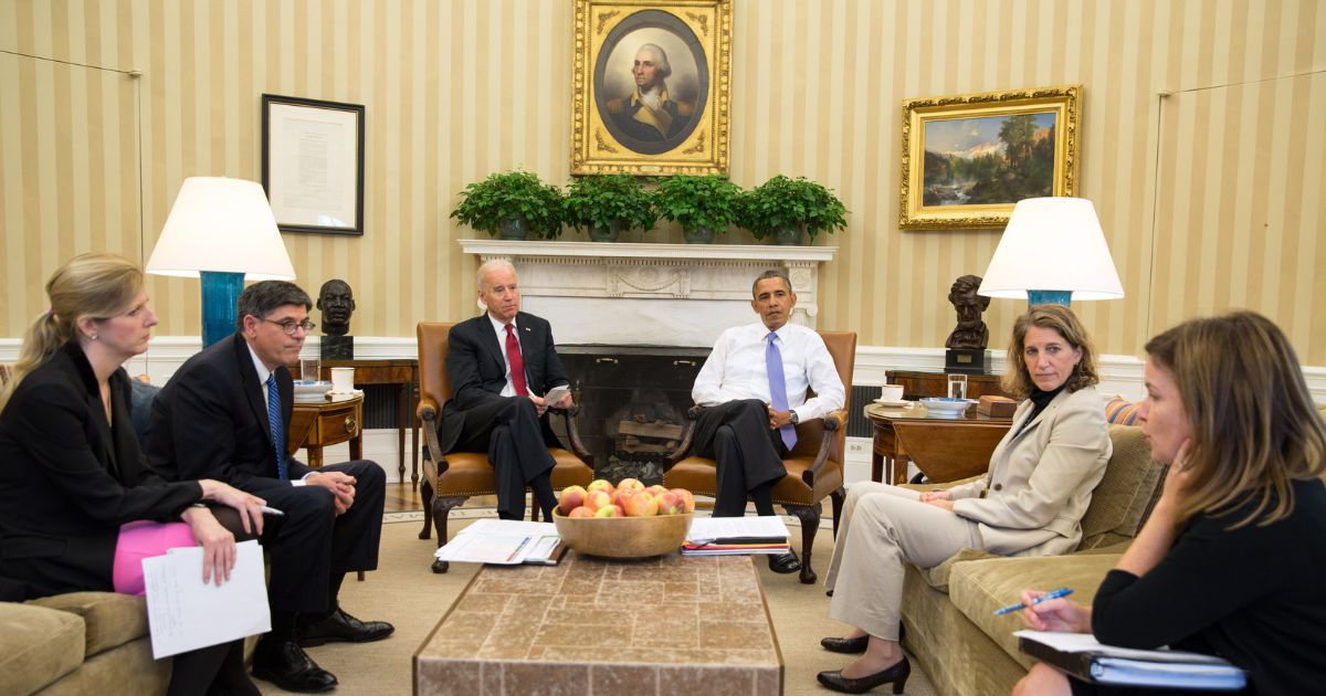 President Barack Obama and Vice President Joe Biden listen as they are updated on the federal government shutdown and the approaching debt ceiling deadline by (L-R) Kathryn Ruemmler, Counsel to the President, Treasury Secretary Jack Lew, Sylvia Mathews Burwell, Director of OMB, and Alyssa Mastromonaco, Deputy Chief of Staff, in the Oval Office in Washington, D.C., on Oct. 1, 2013.