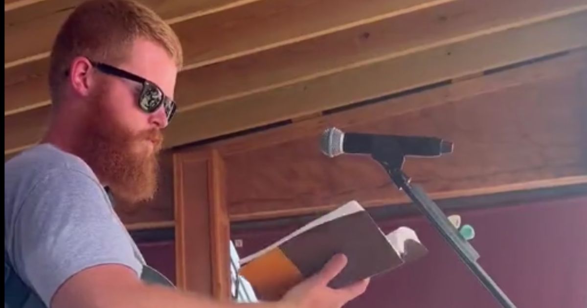 Viral country music sensation Oliver Anthony took the time to open his free concert on Sunday by reading from the Bible.