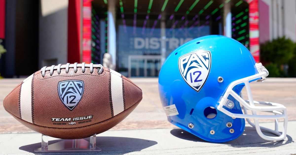 The Pac-12 helmet and official game ball are seen on display at Zouk Nightclub at Resorts World Las Vegas on July 21.