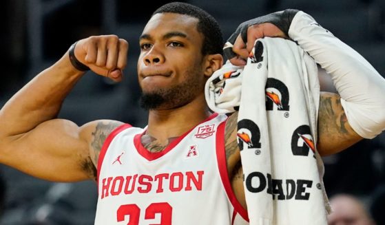 Then University of Houston forward Reggie Chaney celebrates after his teammate scored against Cincinnati in Cincinnati, Ohio, on Feb. 6, 2022.