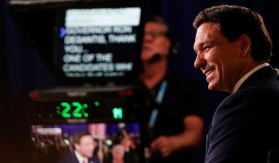 Florida Gov. Ron DeSantis listens during an interview in the spin room after the Republican presidential primary debate hosted by FOX News Channel on Wednesday in Milwaukee, Wisconsin.