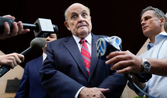 Former Mayor of New York Rudy Giuliani speaks to reporters as he leaves his apartment building in New York City on Wednesday.