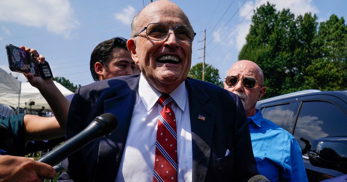 Rudy Giuliani speaks outside the Fulton County jail