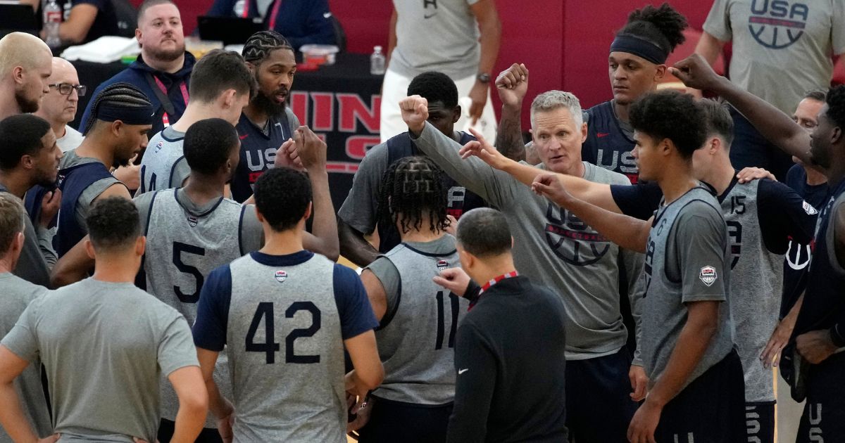 Head coach Steve Kerr of the Golden State Warriors motions as he speaks with his players at a practice during training camp for the United States men's basketball team in Las Vegas on Aug. 3.
