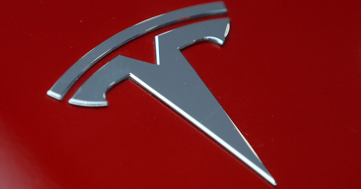 The Tesla logo is displayed at the Paris Motor Show in Paris, France, on Oct. 2, 2018.