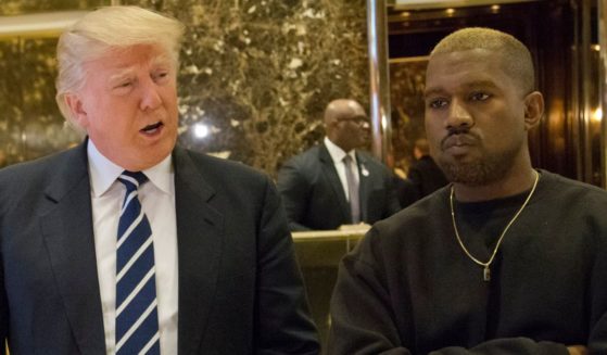 Then-President-elect Donald Trump, left, and Kanye West, right, pose for a picture in the lobby of Trump Tower in New York City on Dec. 13, 2016.