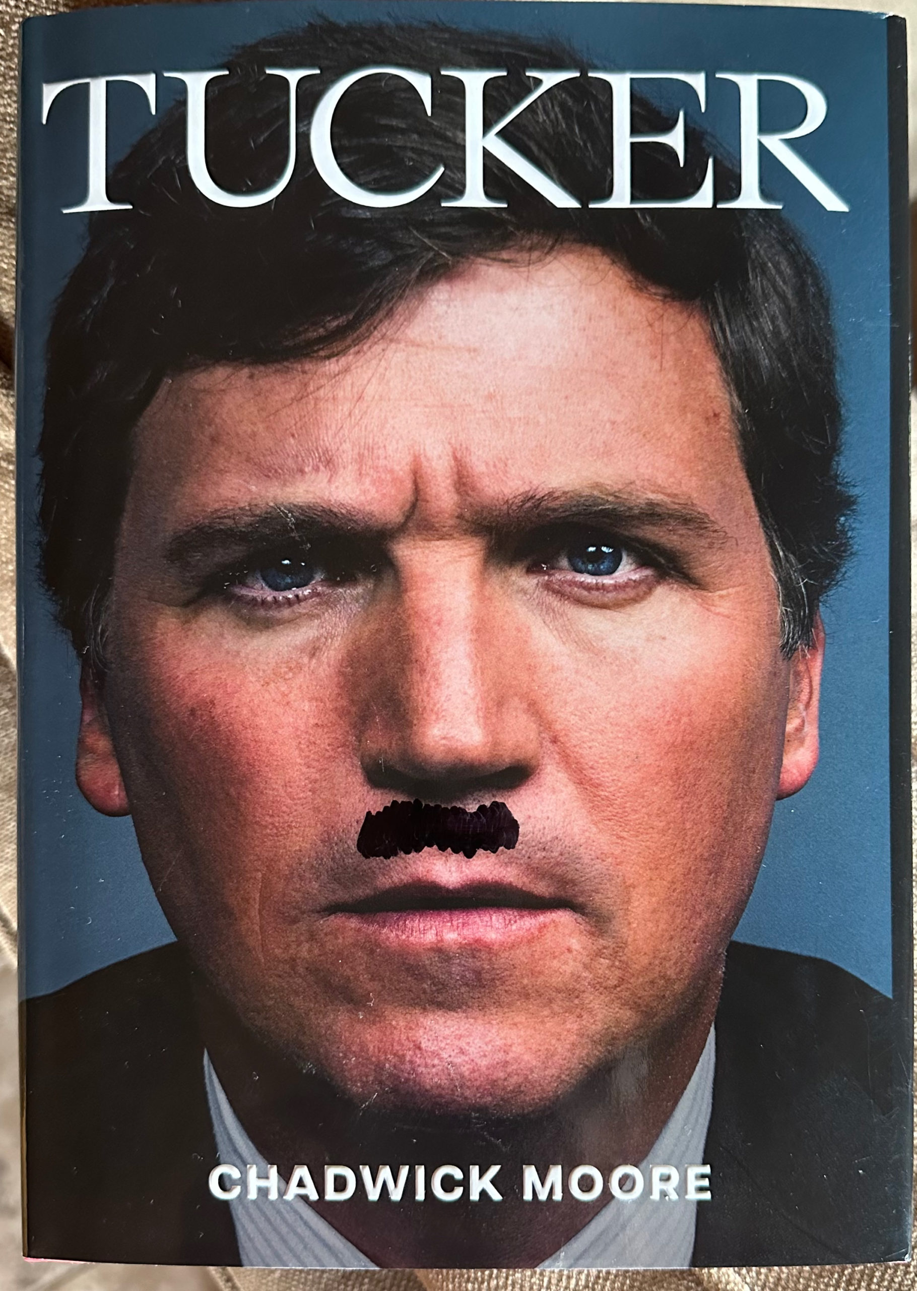 Glenn Dobbs was shocked when he opened an Amazon package with Tucker Carlson's biography. "I couldn't believe that someone in business would do something like that,” he said.