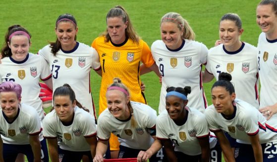 The United States women's national soccer team starters pose for photographers before an international friendly soccer match against Portugal, in Houston, on June 10, 2021.