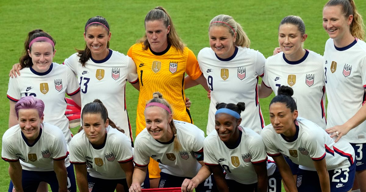 The United States women's national soccer team starters pose for photographers before an international friendly soccer match against Portugal, in Houston, on June 10, 2021.