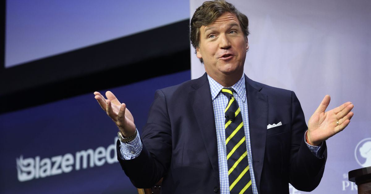 Former Fox News host Tucker Carlson speaks to guests at the Family Leadership Summit on July 14 in Des Moines, Iowa.