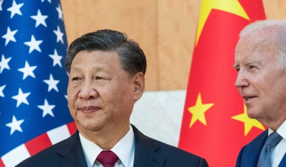 U.S. President Joe Biden standing with Chinese President Xi Jinping