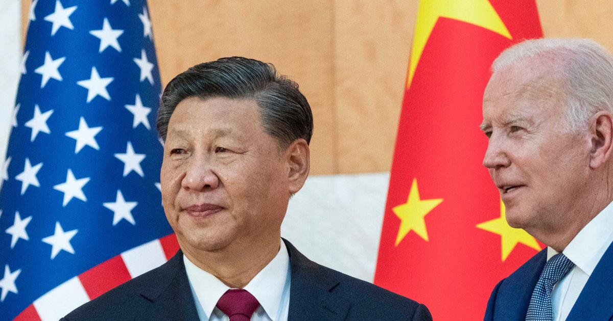 U.S. President Joe Biden standing with Chinese President Xi Jinping