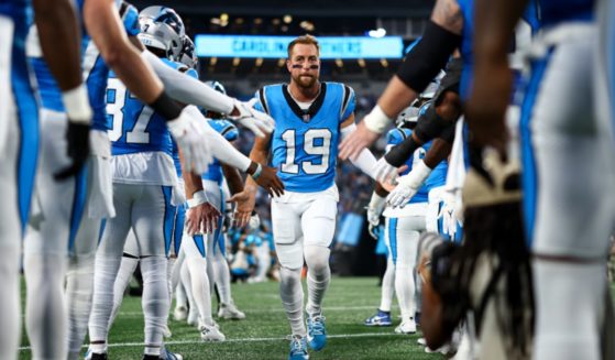 The Carolina Panthers' Adam Thielen runs onto the field Friday before the Panthers preseason game against the Detroit Lions in Charlotte, North Carolina.