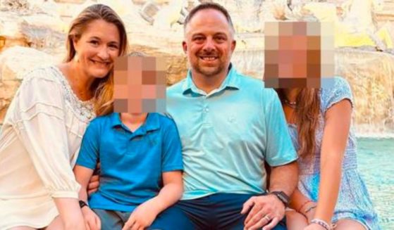 In a Facebook photo, Adrienne Vaughan, left, poses with her husband, Mike, second from right, along with her children, in Rome.
