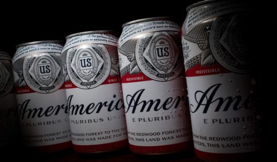 In this photo illustration, cans of Budweiser, rebranded as 'America,' sit on a table, May 23, 2016, in Washington, D.C.