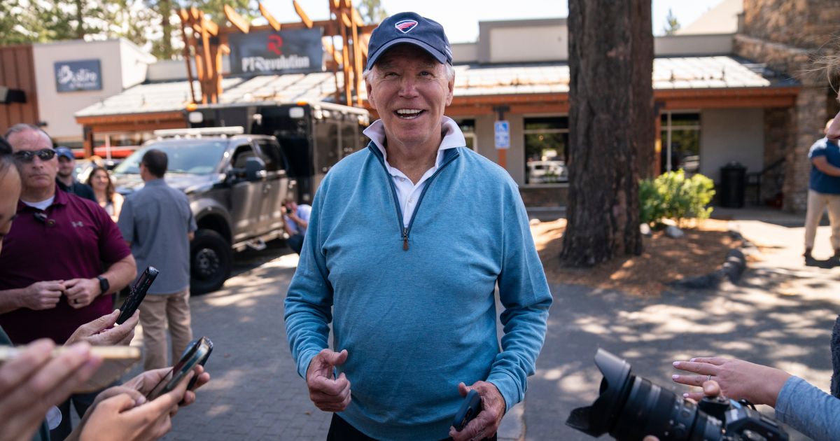 President Joe Biden talks with reporters after taking a Pilates and spin class at PeloDog on Friday in South Lake Tahoe, California.