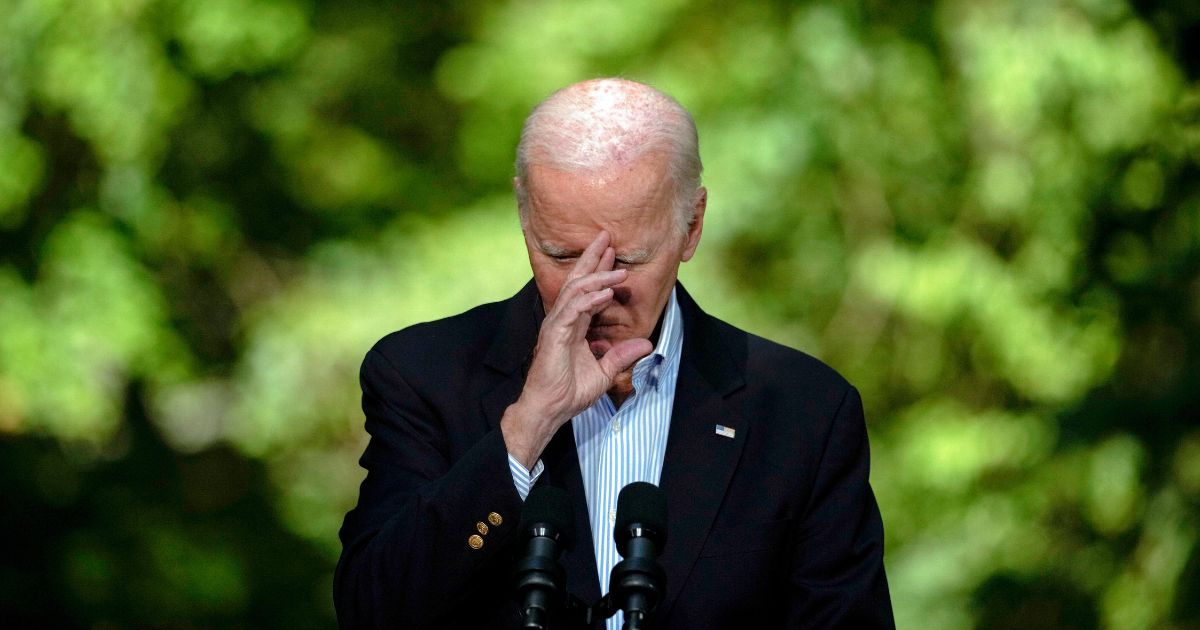 President Joe Biden listens during a joint news conference with Japan's Prime Minister Fumio Kishida and South Korea's President Yoon Suk Yeol on Friday at Camp David, the presidential retreat, near Thurmont, Maryland.