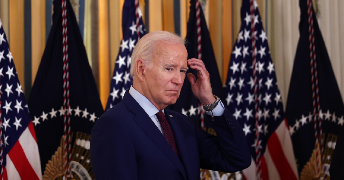 President Joe Biden scratches his head in a July 19 file photo.