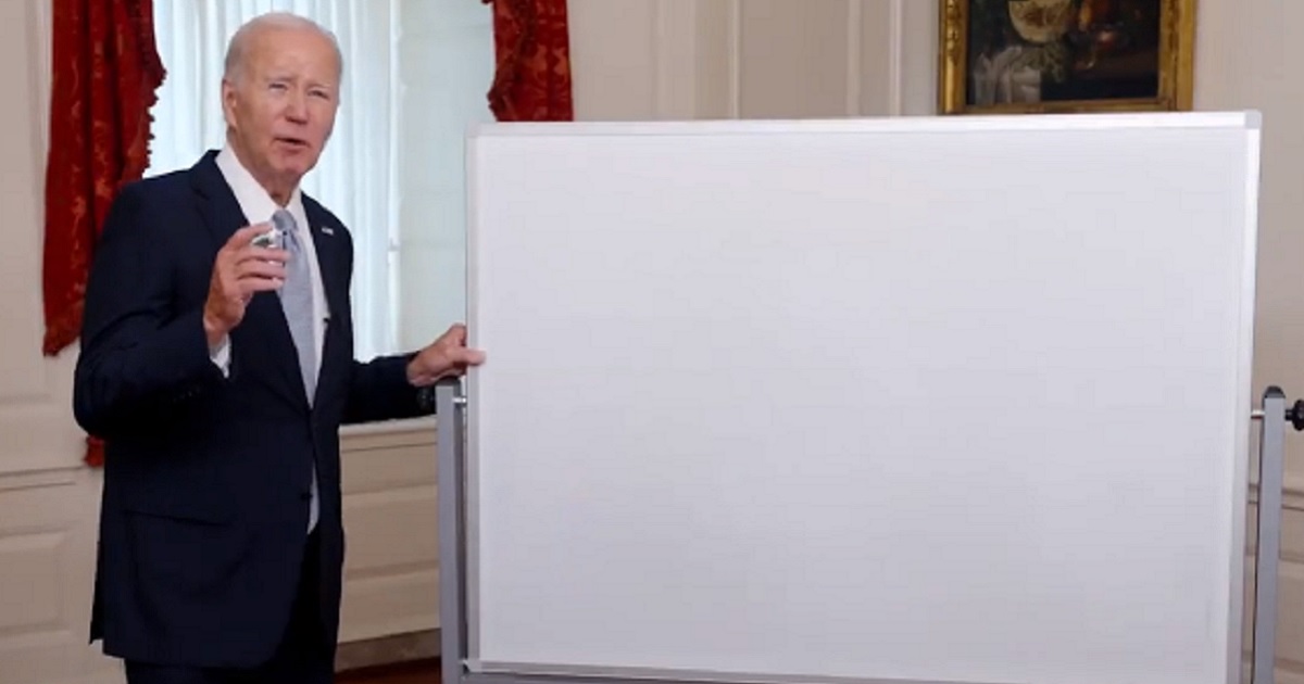 President Joe Biden stands in front of a whiteboard in a video released by the White House last week.