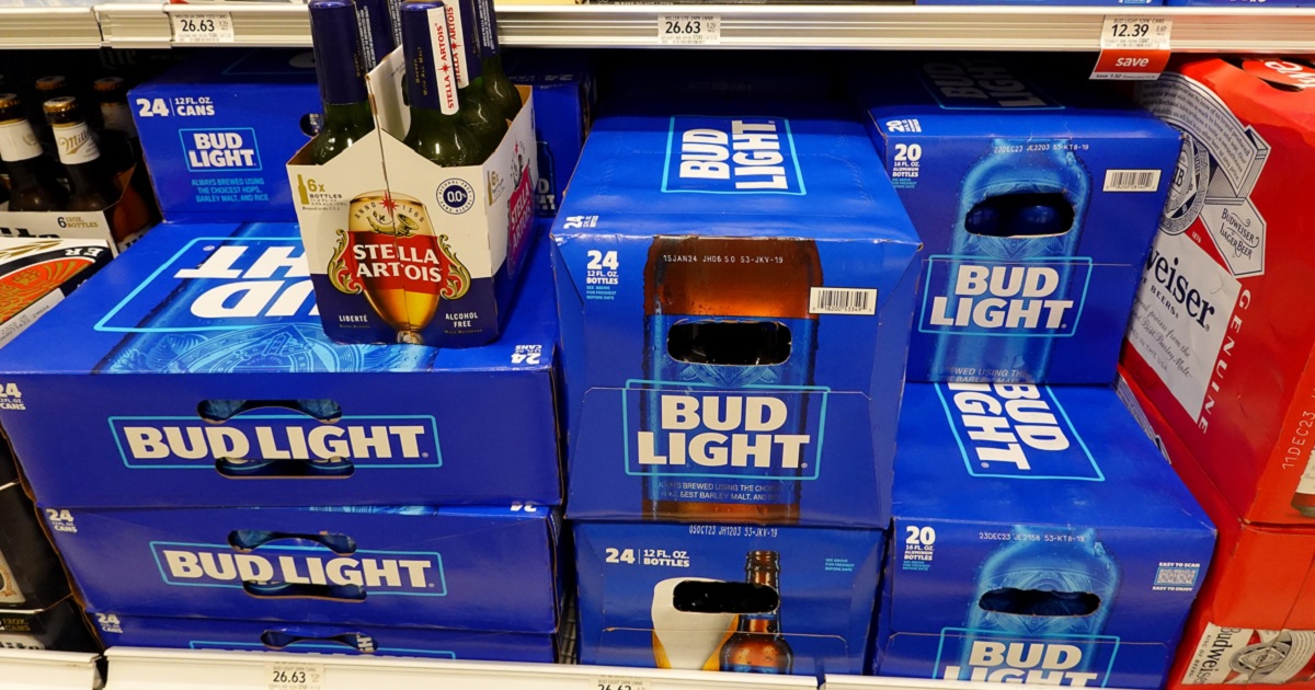 Cases of Bud Light on a grocery store shelf.