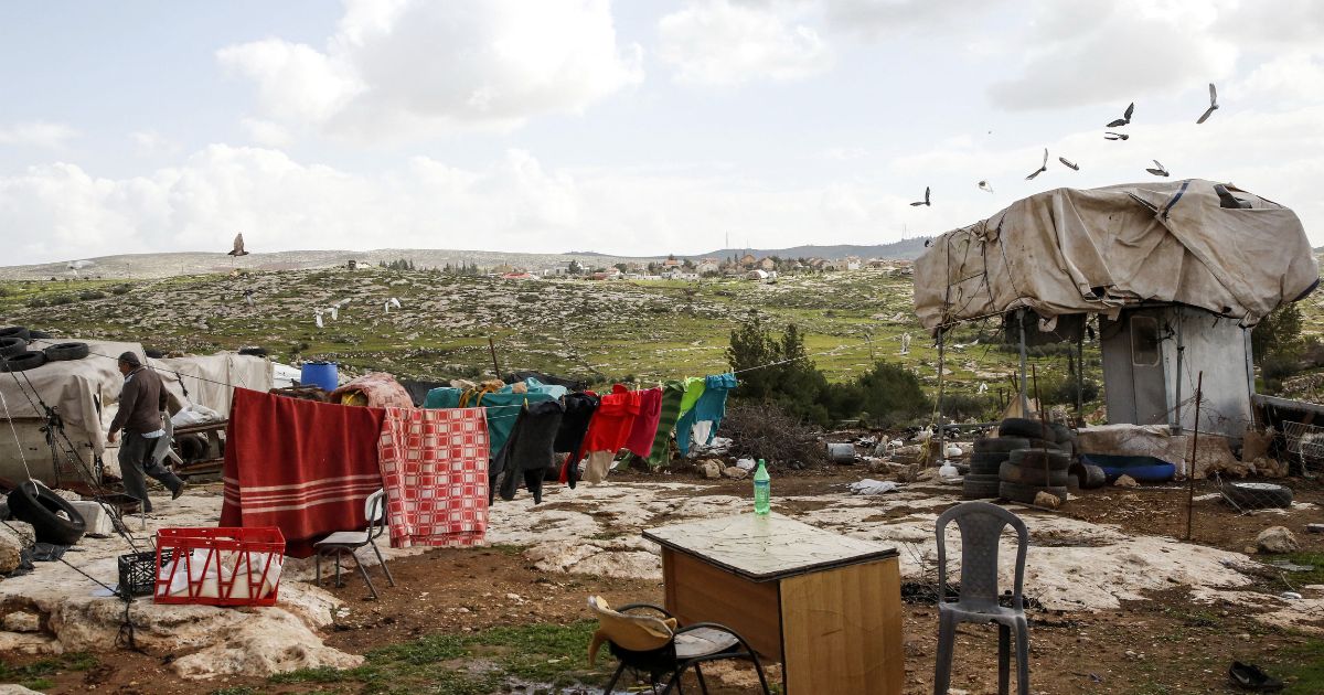 A picture taken on Feb. 27, 2018, shows a tent and a mobile structure where a Palestinian family lives with others near the Israeli settlement of Susya in Area C south of the city of Hebron.