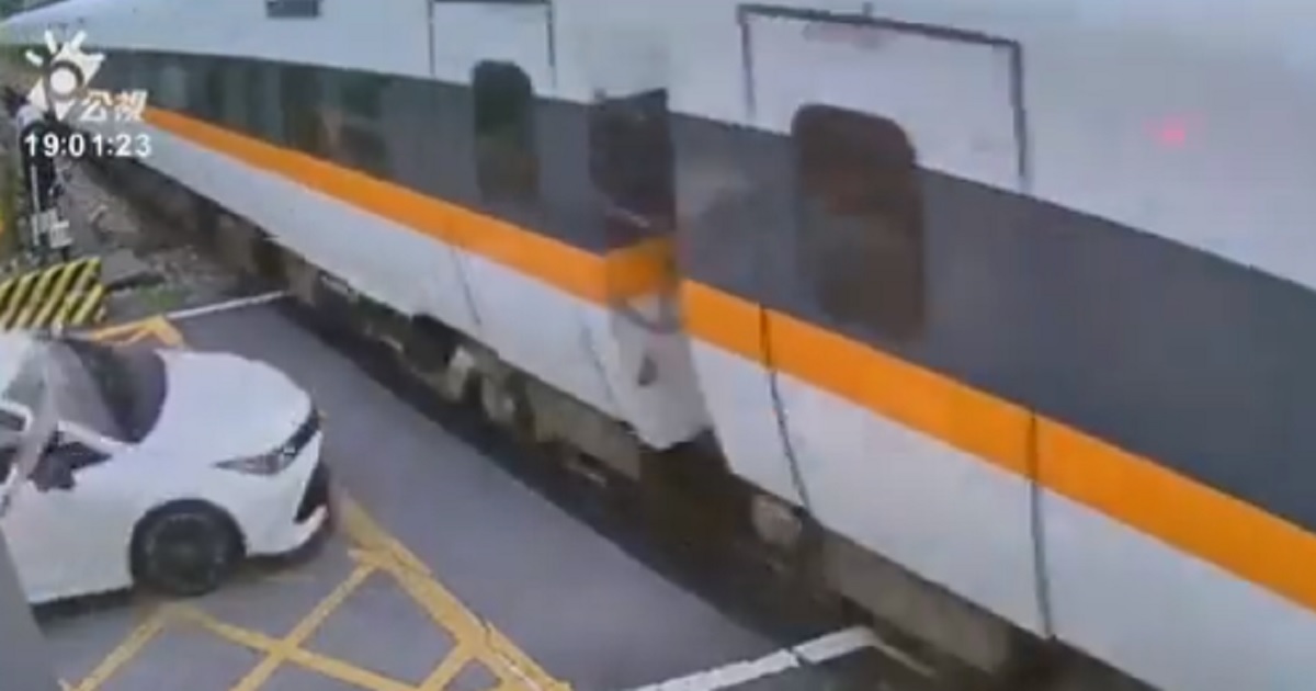 A still captures the moment before a car hit a train at a crossing in Taiwan on Monday.