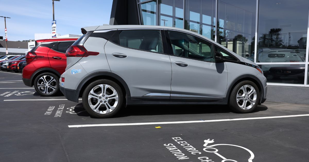 A Chevrolet Bolt EV sits parked at a charging station at Stewart Chevrolet on April 25 in Colma, California.