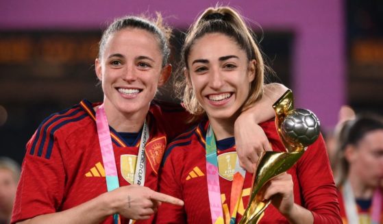 Ona Batlle, left, and Spanish defender Olga Carmona, right, celebrate during the awards ceremony after their victory during the Australia and New Zealand 2023 Women's World Cup final football match against England at Stadium Australia in Sydney on Sunday.