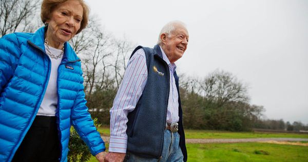 In this Feb. 8, 2017, photo, former President Jimmy Carter, right, and his wife Rosalynn, left, arrive for a ribbon cutting ceremony for a solar panel project on farmland he owns in their hometown of Plains, Georgia. Recently, the former president’s grandson gave a bleak update on his grandfather’s health.